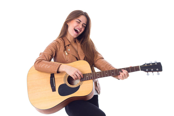 Young woman holding a guitar - Photo, Image
