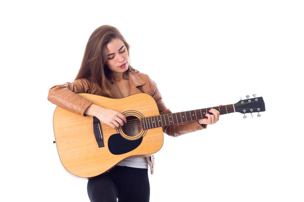 Jovem segurando uma guitarra
 - Foto, Imagem