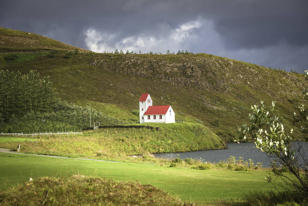 Lonely Church illuminated by sun at Iceland, summer time - Photo, Image