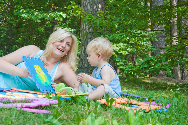 Beautiful Happy Mother Playing With Her Cute Son In The Park - Valokuva, kuva