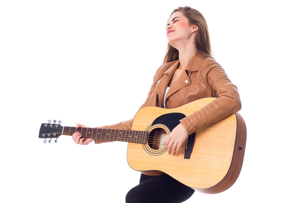 Young woman holding a guitar - Photo, image