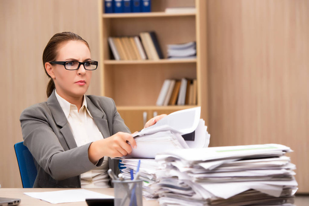 Businesswoman under stress from too much work in the office - Φωτογραφία, εικόνα