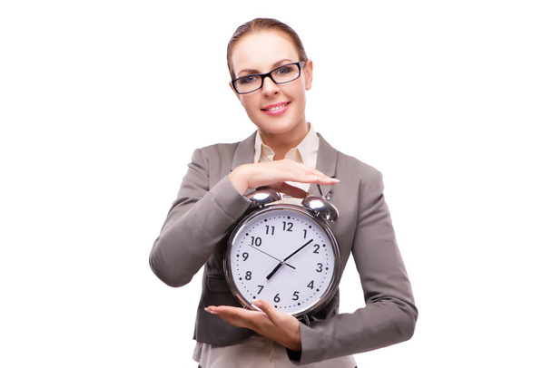 Businesswoman with giant alarm clock isolated on white - Photo, Image