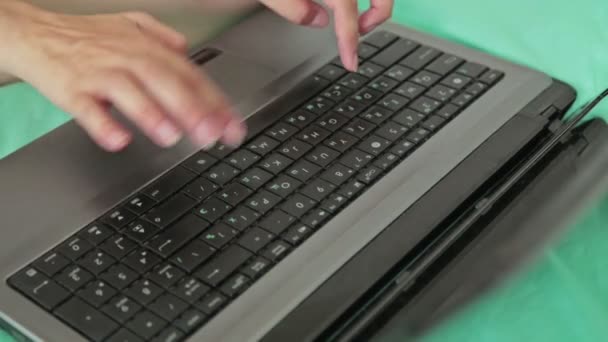 Womans hands typing on a laptop keyboard - Footage, Video