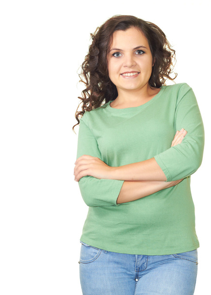 Attractive smiling girl in green shirt standing with hands folde - Foto, Bild