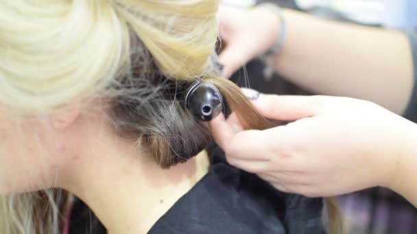 Professional hair tresses for a girl model in a beauty salon or in the studio - Footage, Video