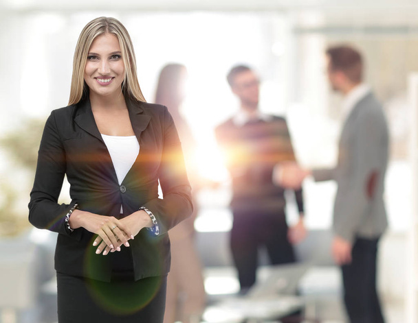 Face of beautiful woman on the background of business people - Foto, Bild