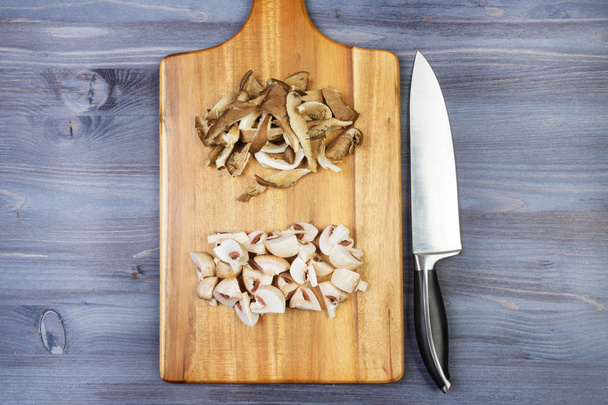 Wooden spoon and ingredients on dark background. Vegetarian food, health or cooking concept - Фото, зображення