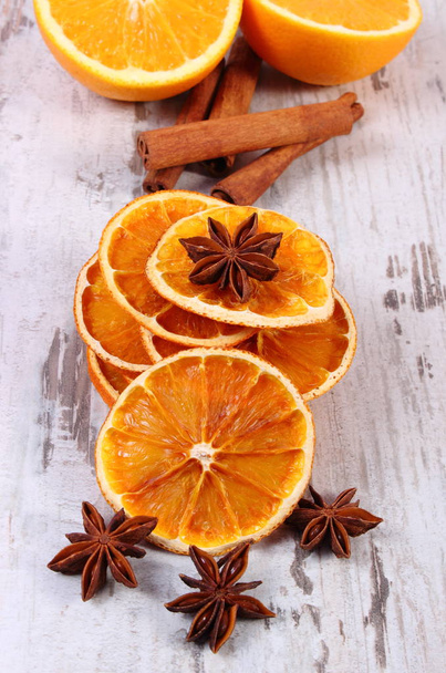 Dried and fresh orange with spices on old wooden background - Foto, Imagem