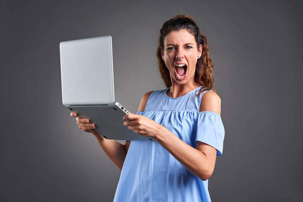 Young woman with laptop  - Φωτογραφία, εικόνα