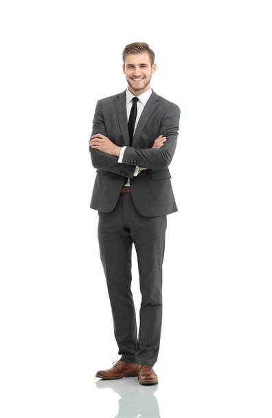 portrait in full length of a smiling young businessman with a st - Foto, immagini