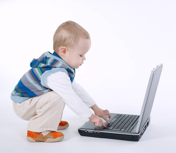 cute boy with laptop on white - Zdjęcie, obraz