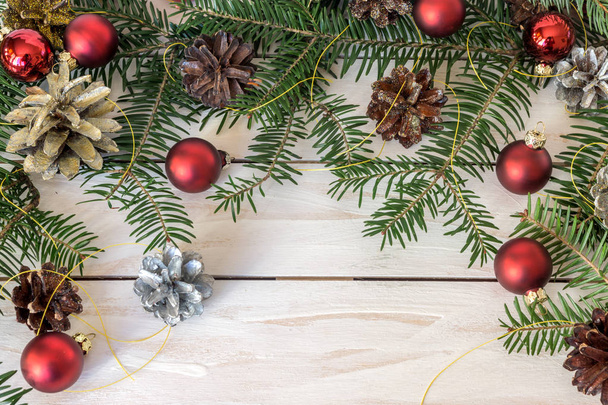 Christmas decoration with branches from fir cones and toys - Fotografie, Obrázek