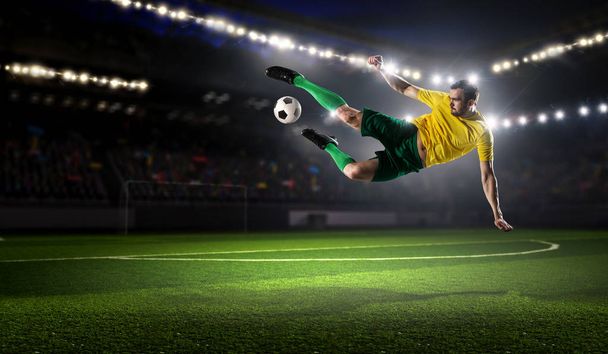 Soccer player kicking ball . Mixed media - Zdjęcie, obraz