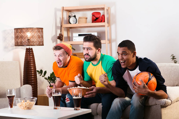 Friends watching football game - Foto, imagen