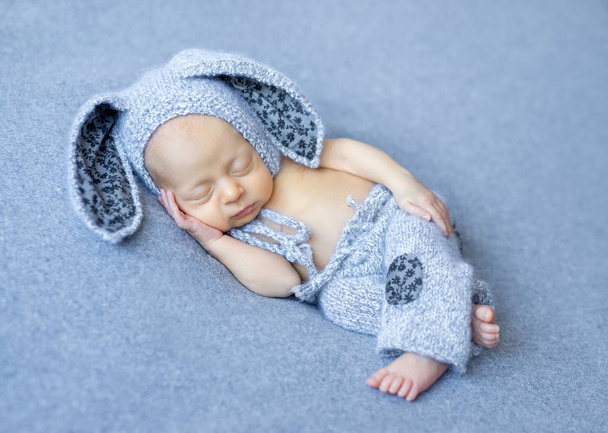 lovely newborn boy in hare suit - Zdjęcie, obraz