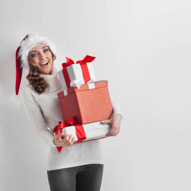 Woman with stack of gifts - Foto, Imagen