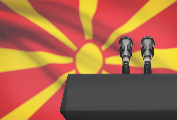 Kanzel und zwei Mikrofone mit einer Nationalflagge auf Hintergrund - Mazedonien - Foto, Bild