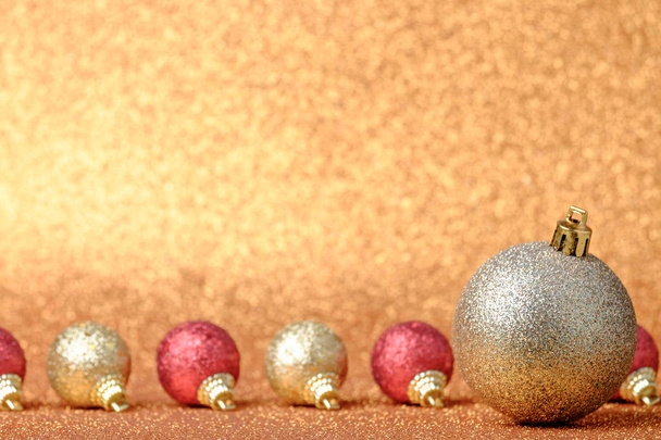 Christmas decorations on a glitter background - Photo, image