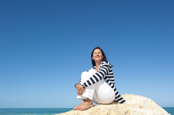 Relaxed mature woman ocean background - Fotografie, Obrázek