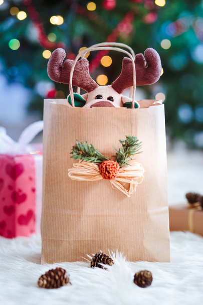 Reindeer toy in a bag for Christmas gift - Fotografie, Obrázek