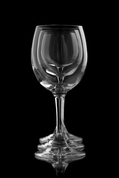 Three elegant wine glasses in a black background - Fotografie, Obrázek