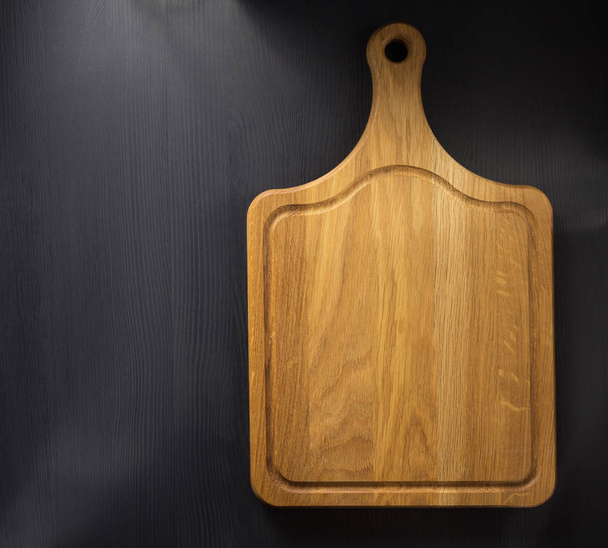 cutting board at wooden table  - Фото, зображення