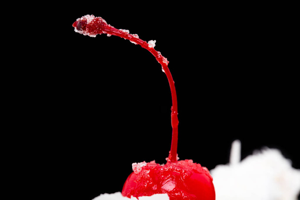 Cocktail cherry on top of delicious cake.  - Valokuva, kuva