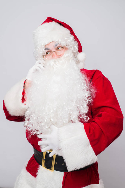 Santa Claus on christmas calling by phone. Isolated. - Φωτογραφία, εικόνα