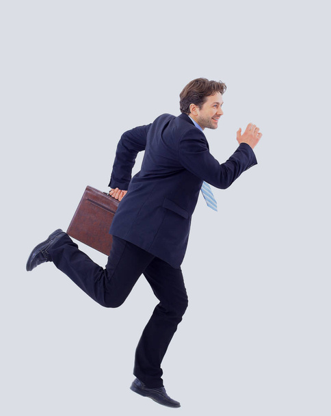 young business man running isolated on white background - Foto, immagini