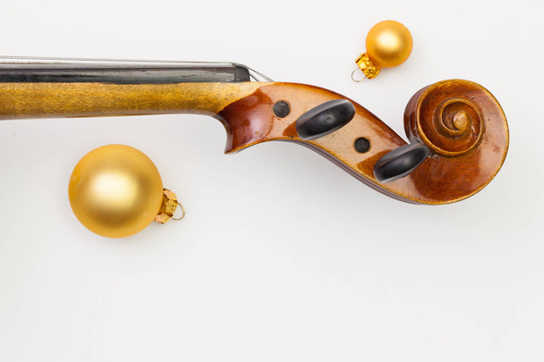 Top view close up shot of old violin and Christmas decoration.  - Photo, image