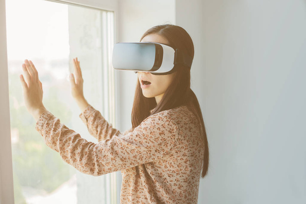 Woman with glasses of virtual reality. Future technology concept. - Photo, image