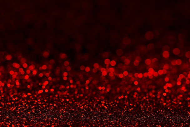  Abstract dark red glitter background with shining light and soft bokeh, festive colors - Foto, imagen