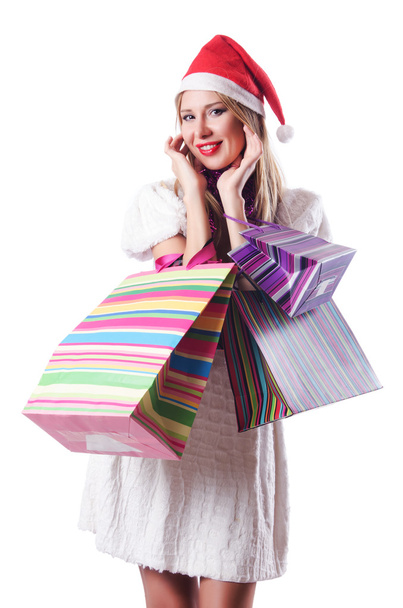 Молода жінка в концепції різдвяних покупок
 - Фото, зображення