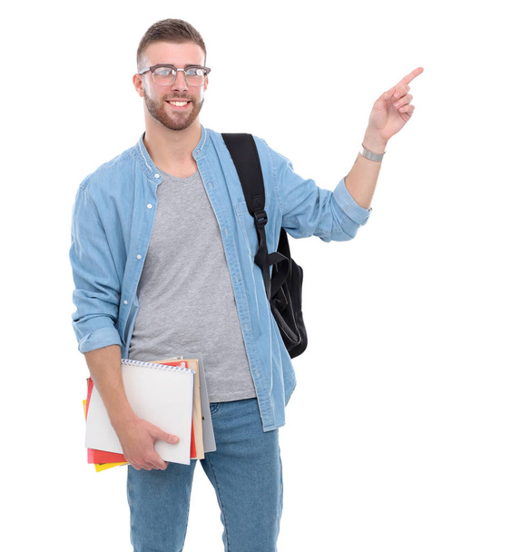 Young male student with school bag holding books isolated on white background - 写真・画像