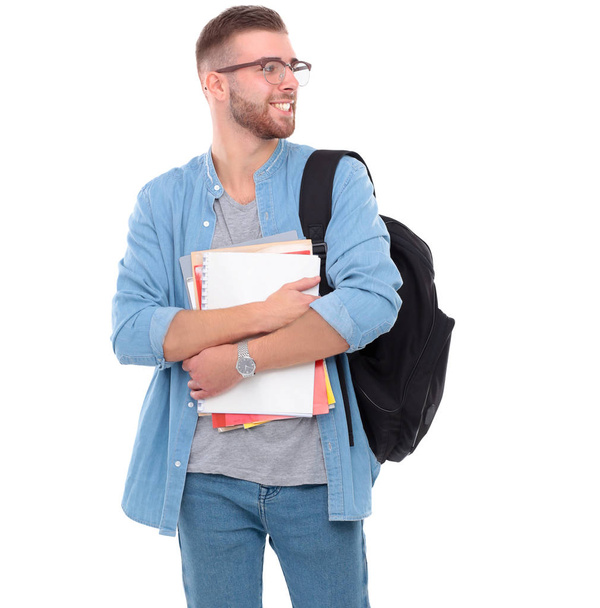 Jeune étudiant avec sac d'école tenant des livres isolés sur fond blanc
 - Photo, image