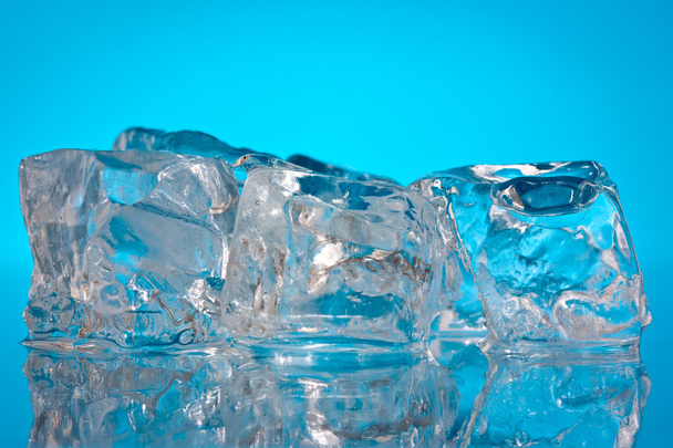Ice cubes on a blue background - Foto, Imagen