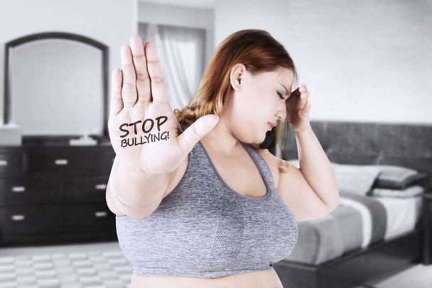 Woman with stop bullying word in hand  - Fotó, kép
