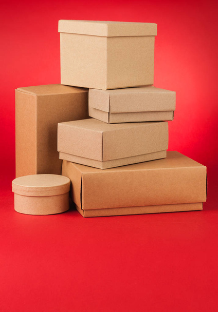 Boxes on red background - Foto, Imagem