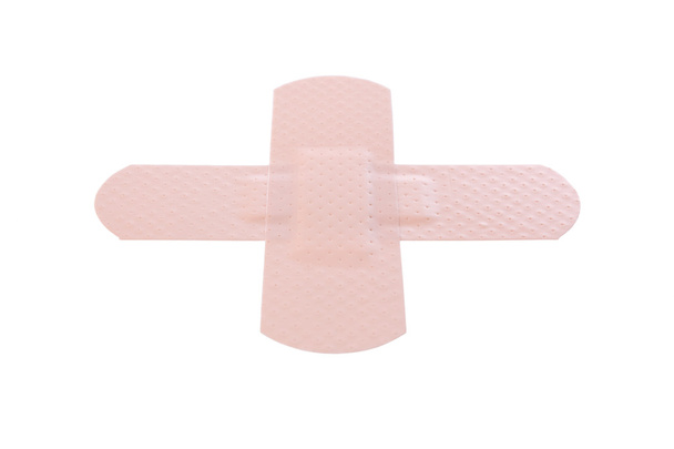 Cross made with bandaids isolated on white - Photo, Image