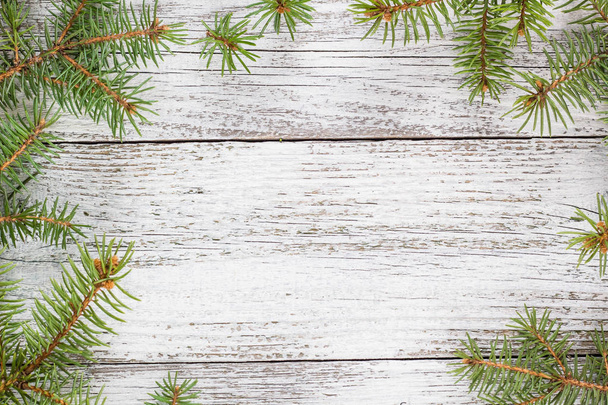 Christmas wooden background with fir tree. Top view copy space - Photo, Image