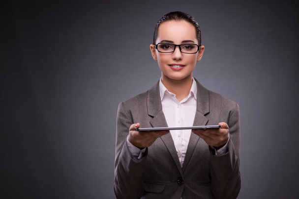 Young woman with tablet in business concept - Photo, Image