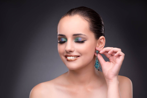 Beautiful woman showing off her jewellery in fashion concept - Photo, Image