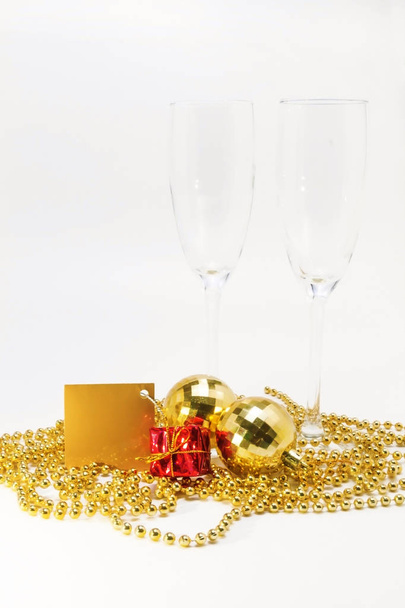 empty glasses and gold Christmas decorations isolated - Foto, Imagen