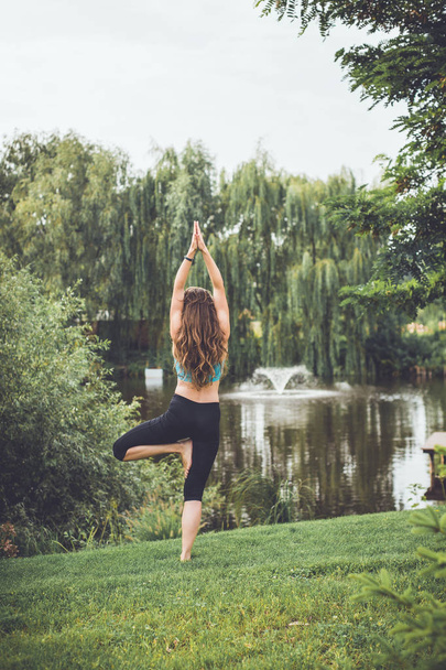 young woman doing yoga - Фото, изображение
