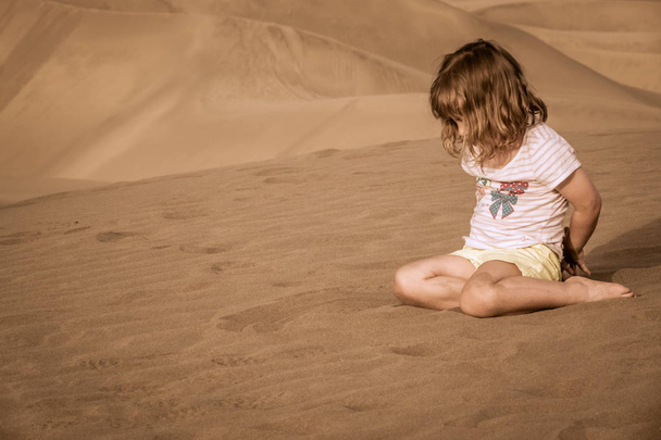 Girl on the sand dunes - 写真・画像