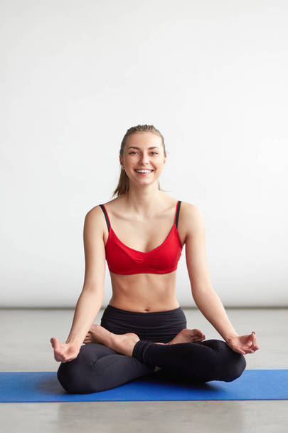 beautiful young woman doing yoga exercise - Фото, изображение