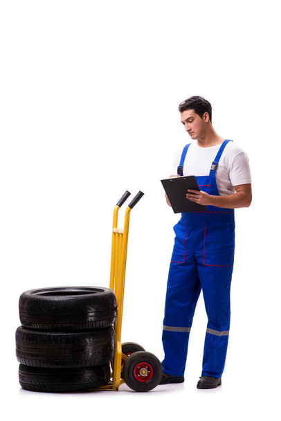 Handsome tyre repairman isolated on white - Фото, зображення