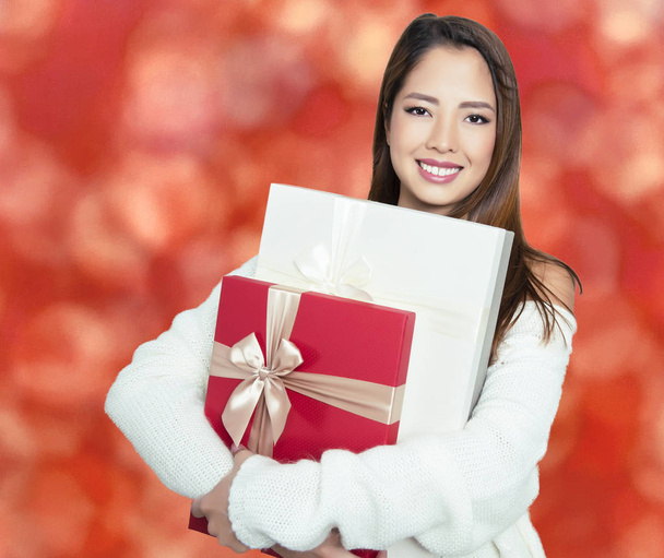 beautiful young asian woman holding present - 写真・画像