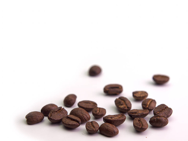 Brown coffee beans, Placed on a white background. - Фото, зображення